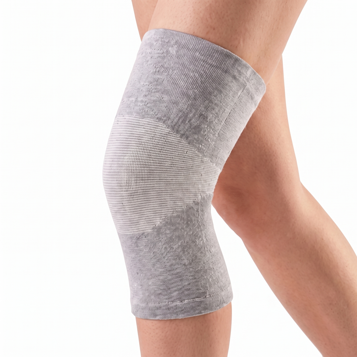 Genouillère de compression SovaFlex grise portée, vue de profil